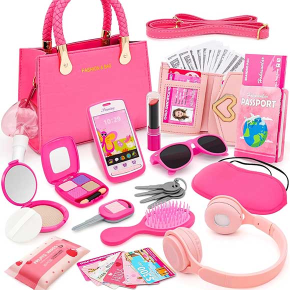 Borsetta rosa con trucchi giocattolo e accessori da viaggio